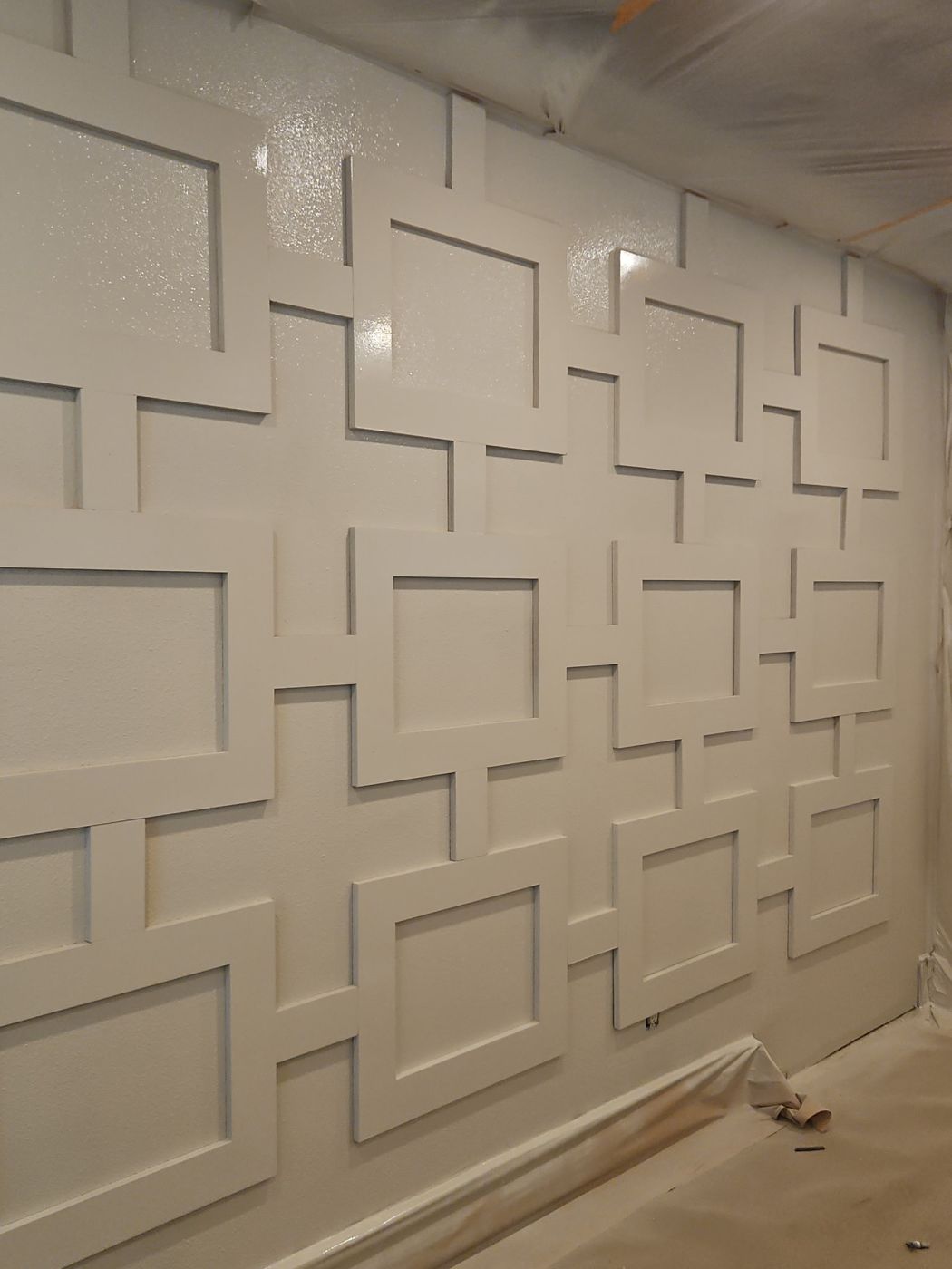 White painted geometric trim accent wall in a home interior